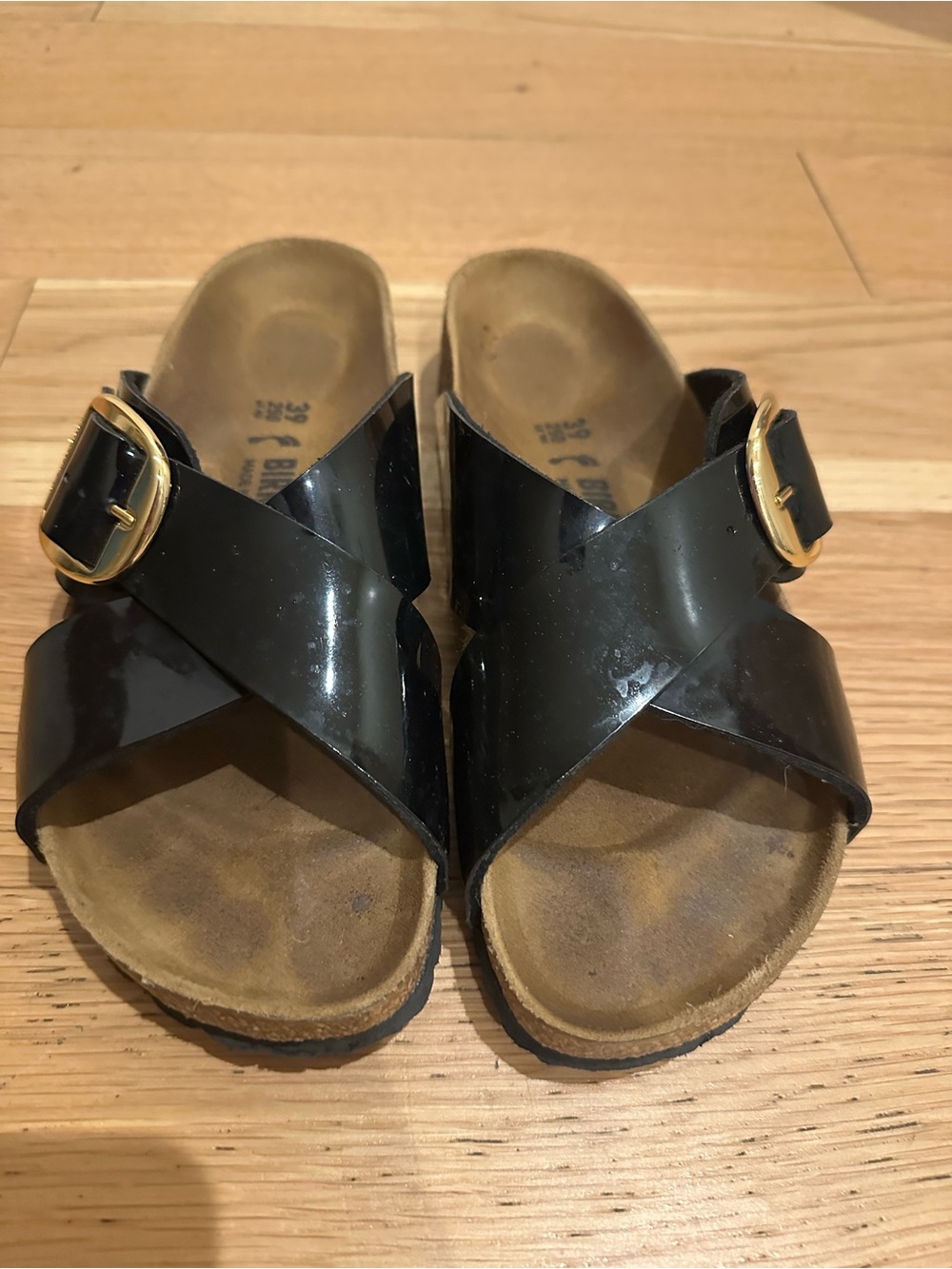 Birkenstock Black Patent Cross-Strap Sandals with Gold Buckles